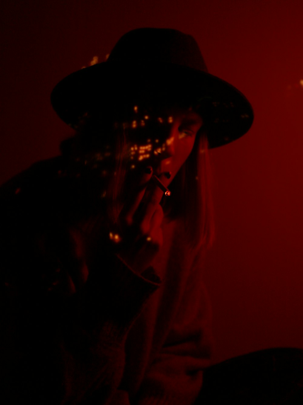 man in black hat playing musical instrument