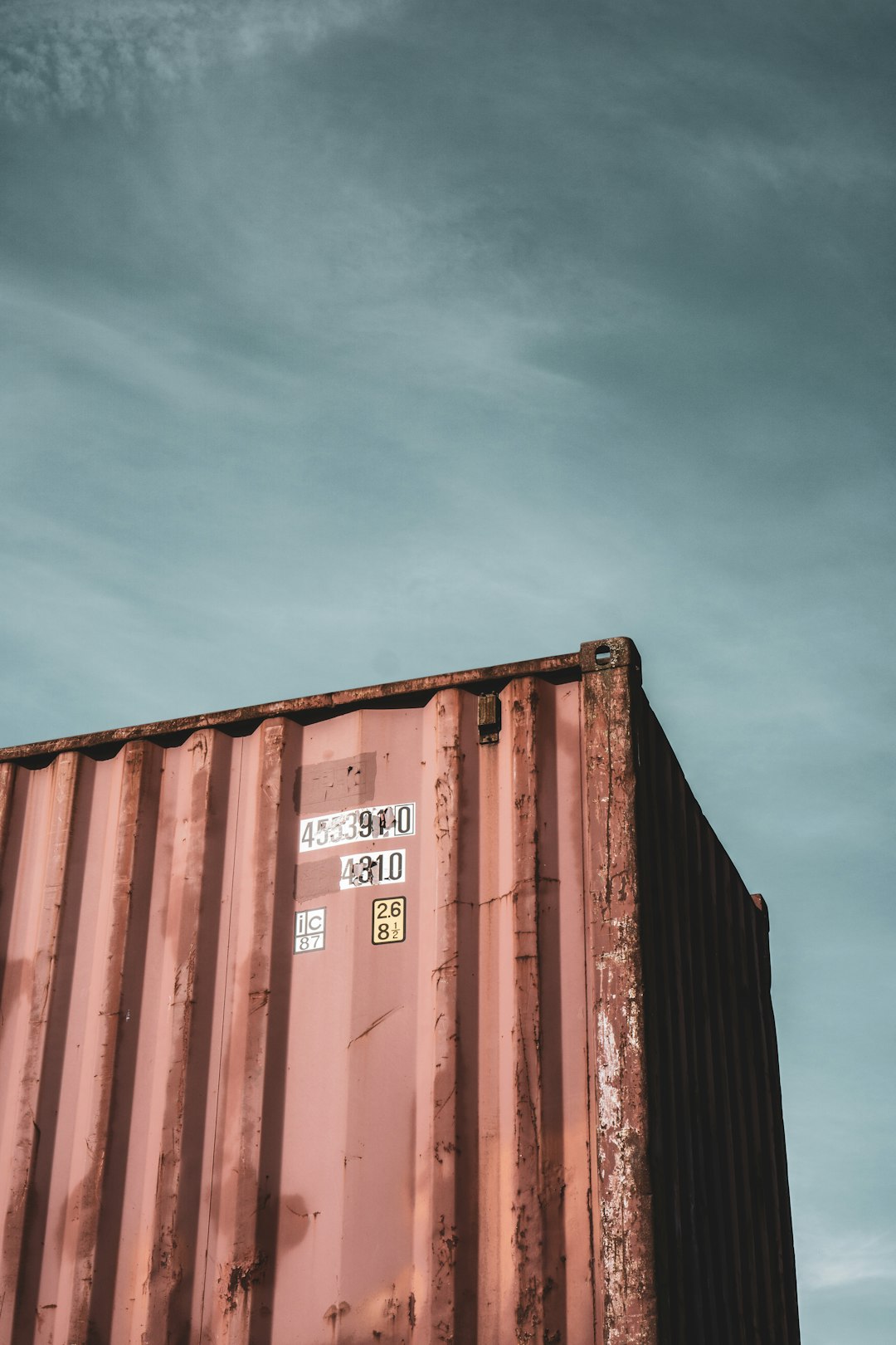 brown steel container van under blue sky during daytime