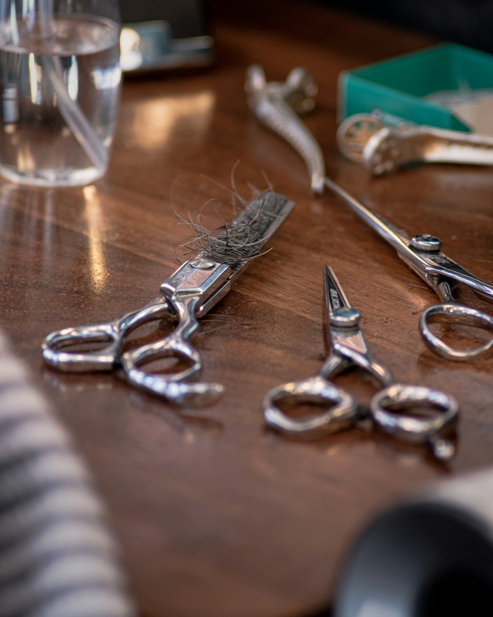 silver keys on brown wooden table