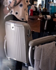 A stylish grooming station with neatly arranged tools and a comfortable chair ready for clients.