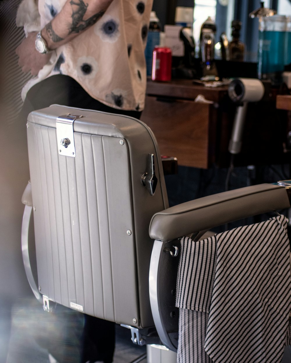 white portable air cooler beside white and black stripe textile