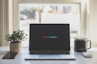macbook pro on white table