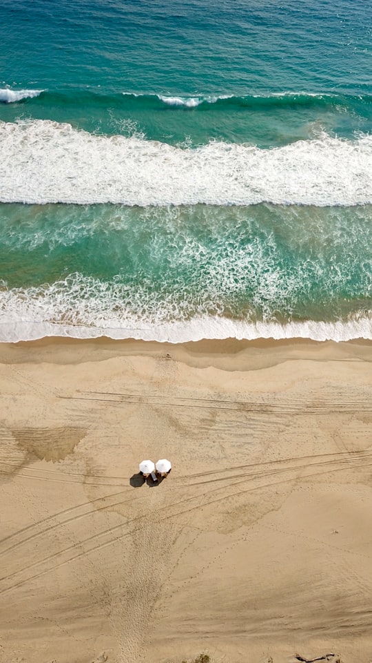 white and black soccer ball on beach during daytime in Puerto Escondido Mexico