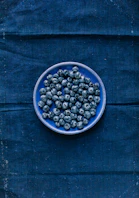 blue berries on blue round plate