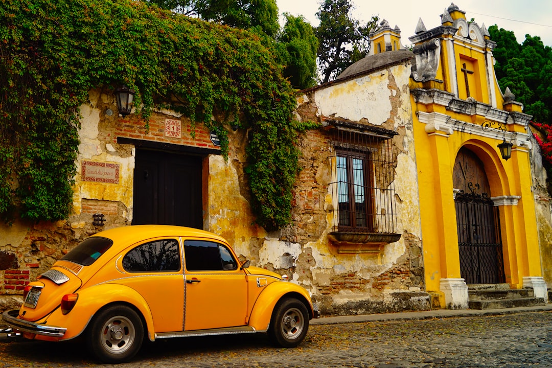 a yellow car parked in front of a building