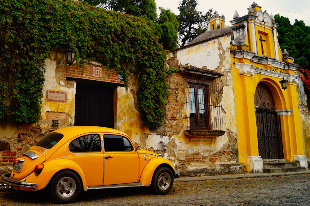 a yellow car parked in front of a building