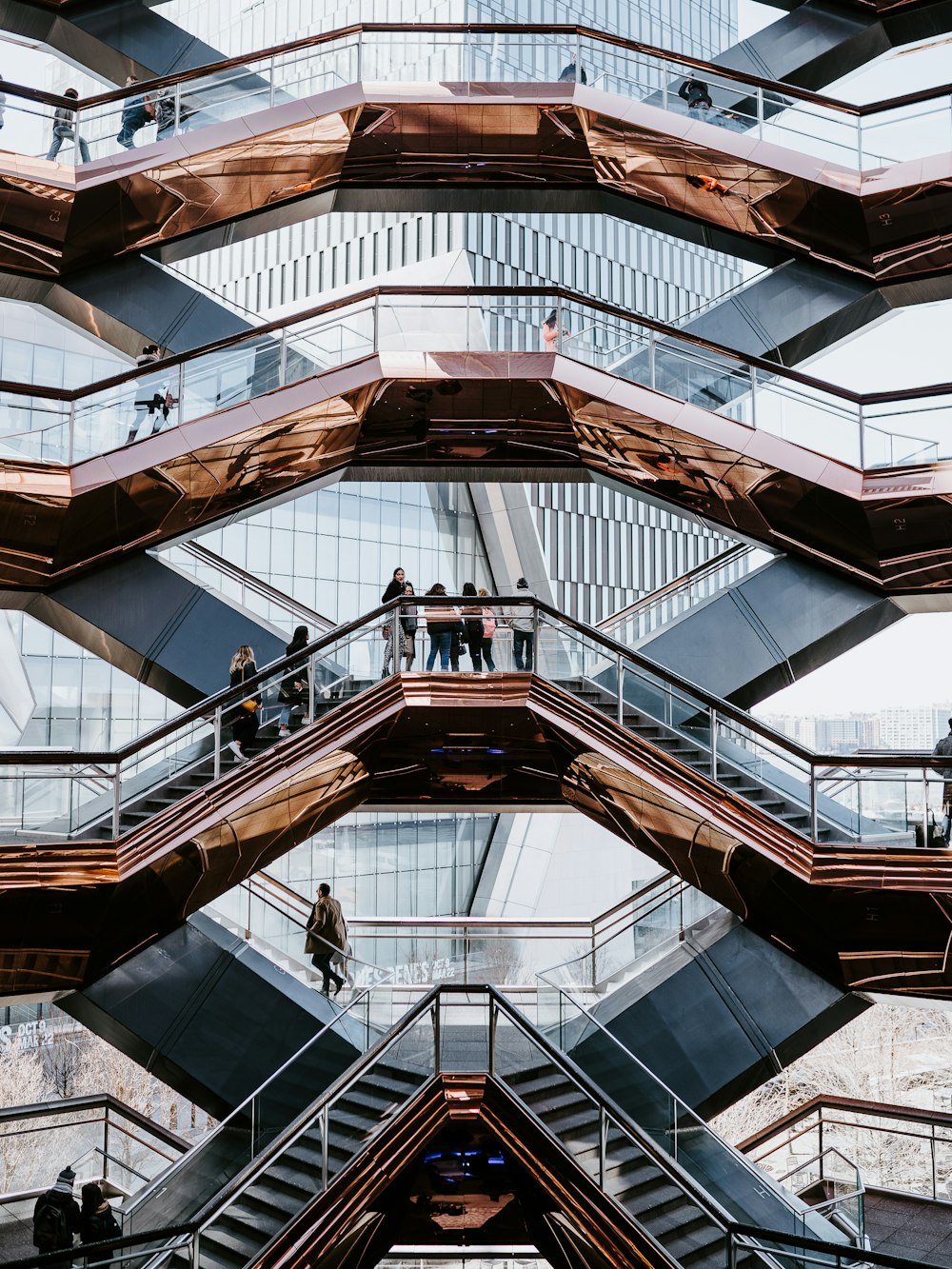 people walking on white and brown building