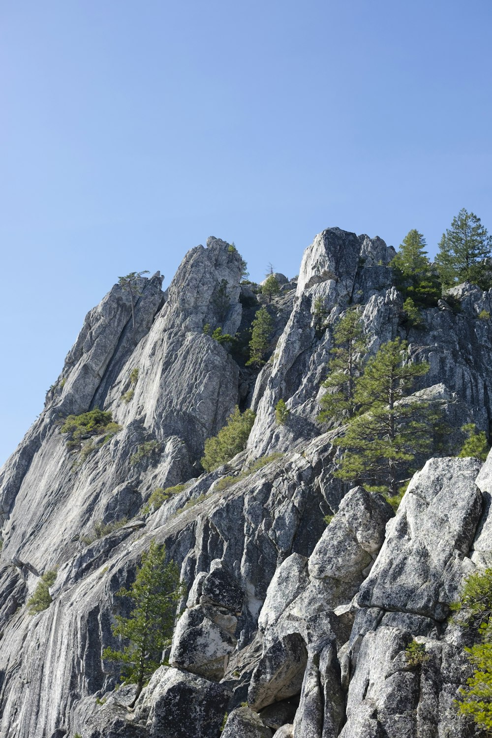 gray rocky mountain under blue sky during daytime