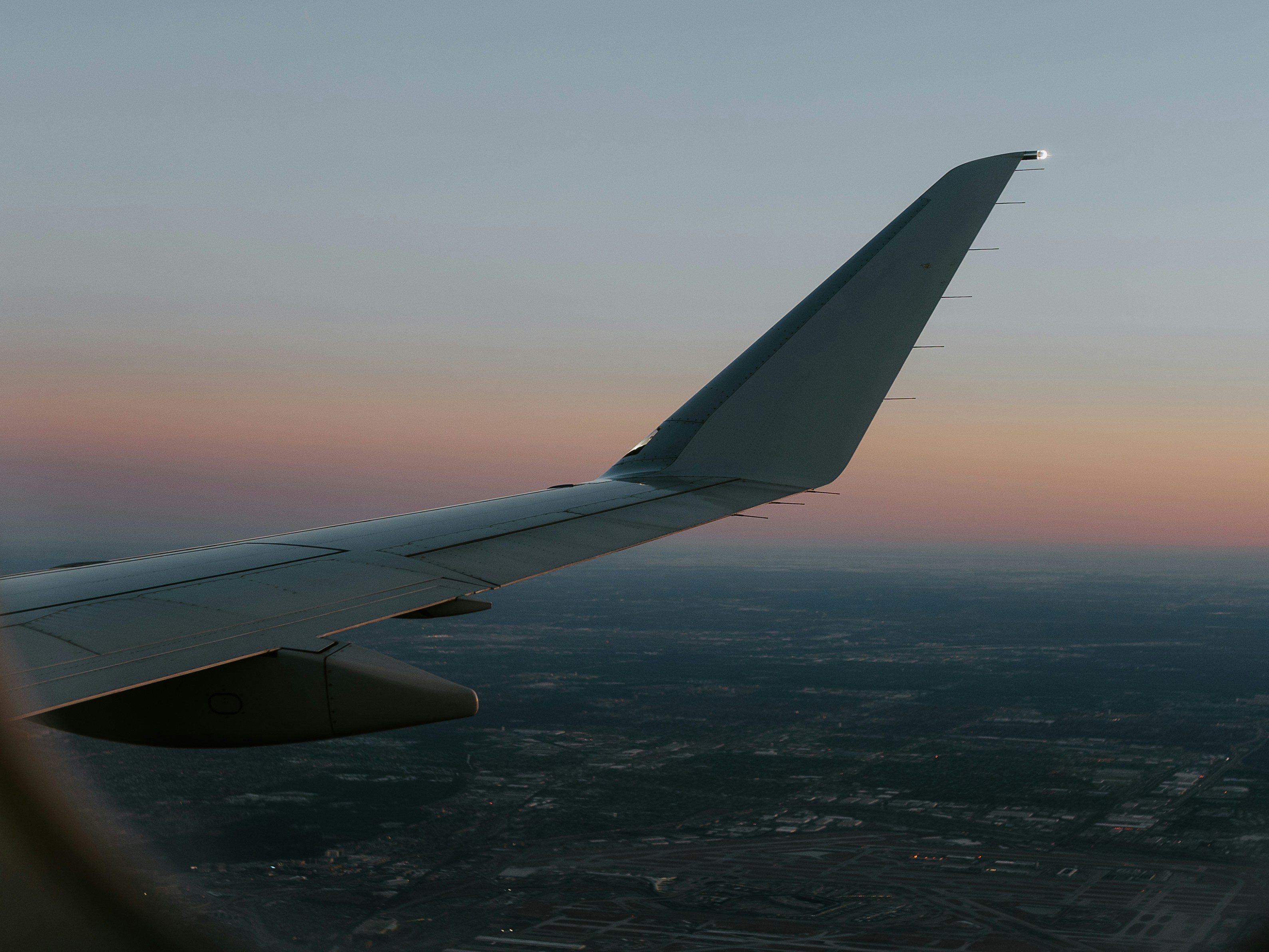 airplane wing over the clouds during daytime, 