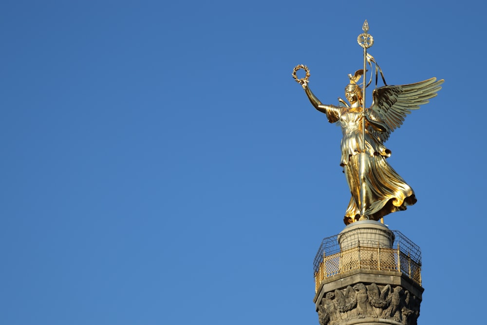 gold statue of a man