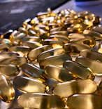 gold round coins on blue textile