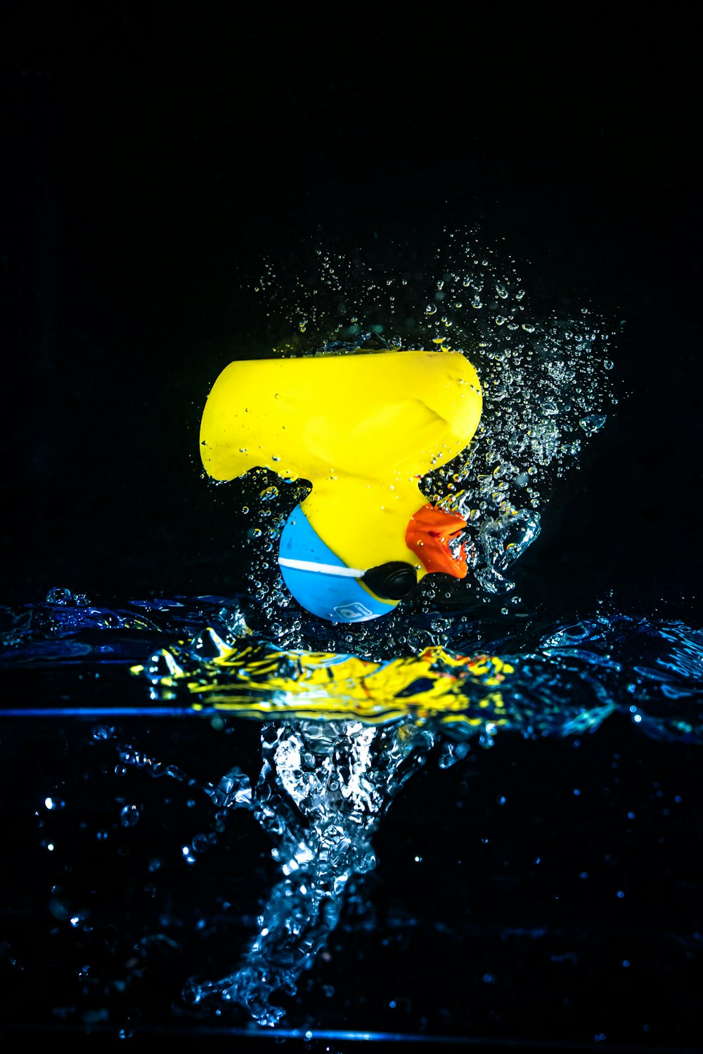 yellow plastic cup on water