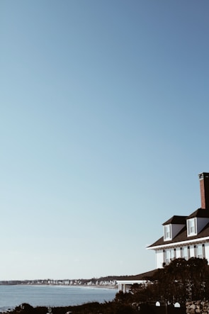 A scenic view of a cedar shake roof on a coastal home.