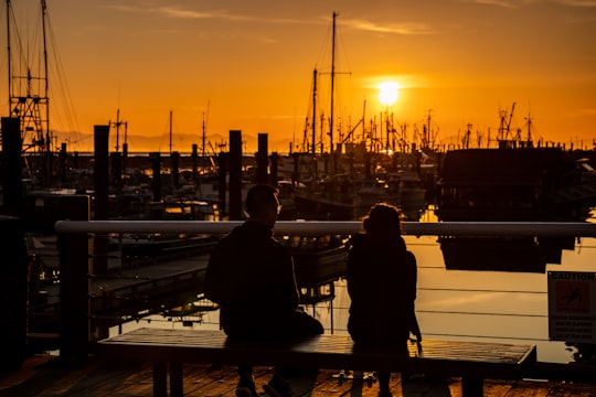 silhouette of man standing on dock during sunset in Steveston Canada