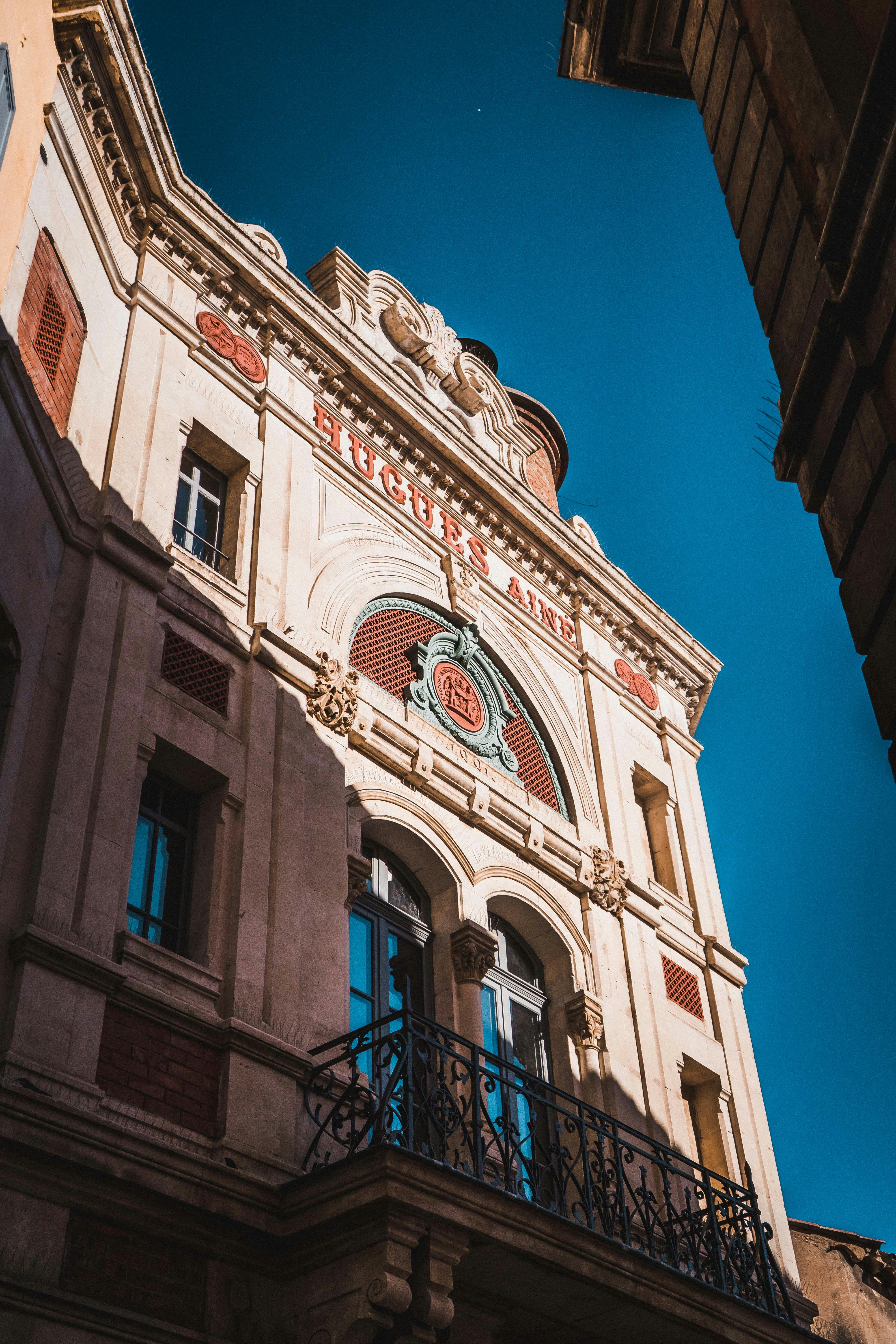 white and brown concrete building under blue sky during daytime