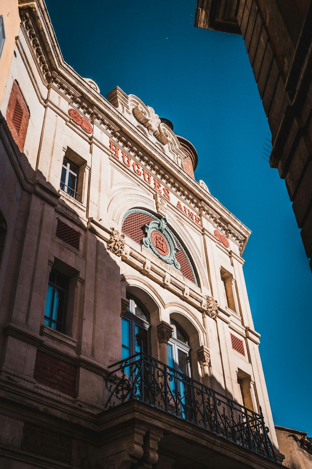 white and brown concrete building under blue sky during daytime