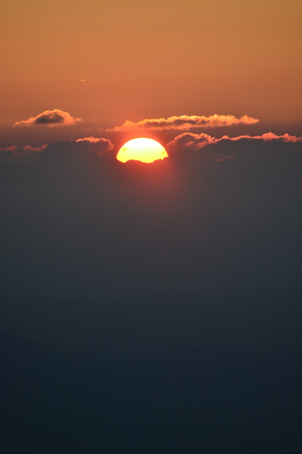 sun setting over the clouds
