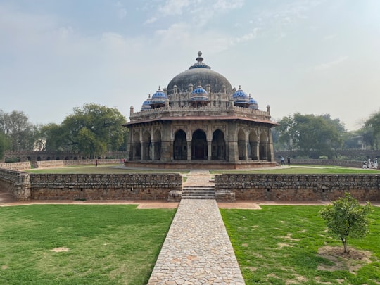 brown concrete building under blue sky during daytime in Isa Khan's Tomb India