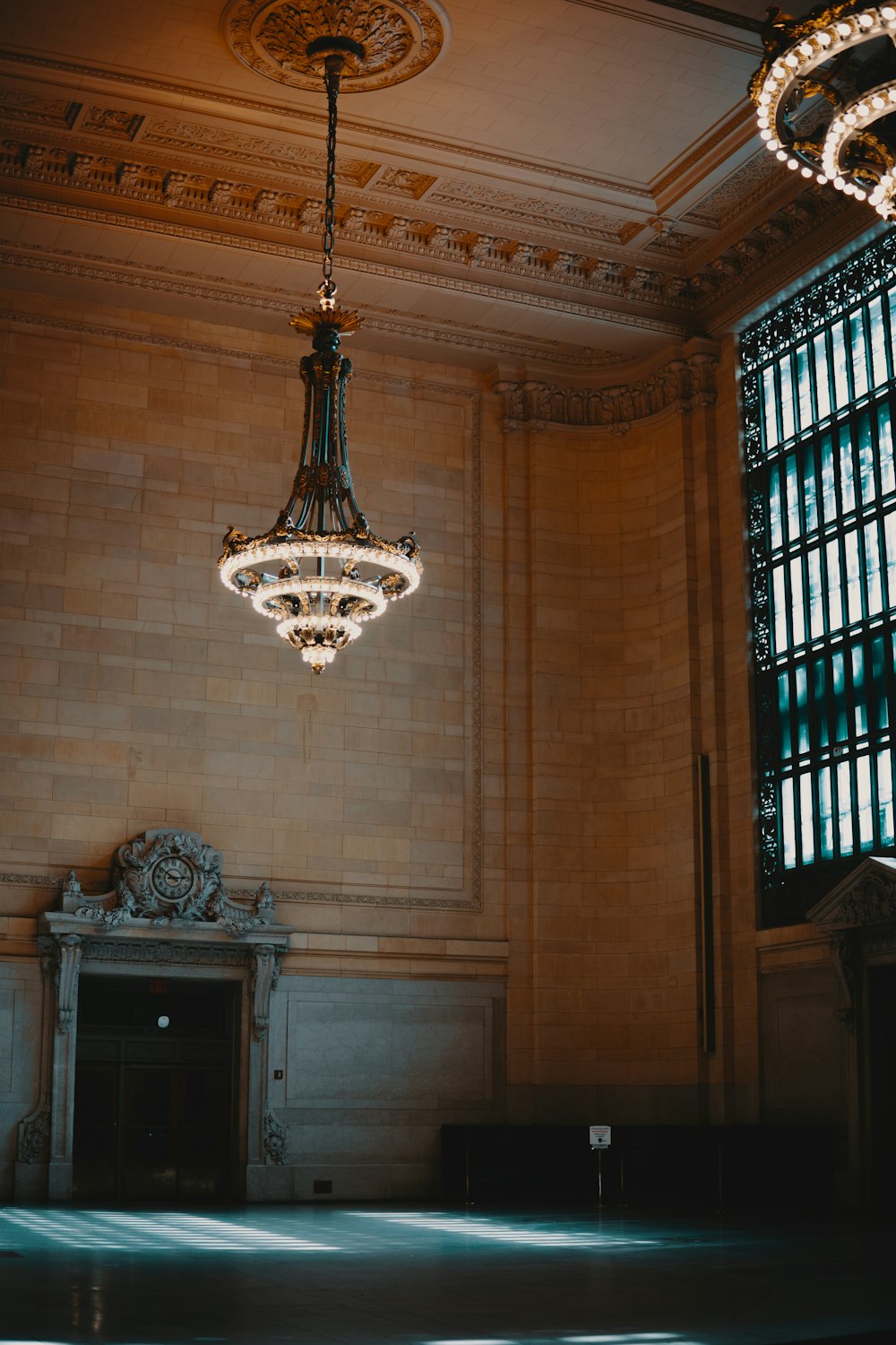 silver chandelier on brown ceiling