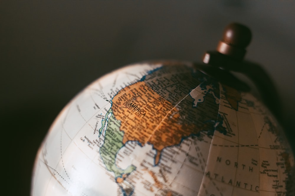 white and brown desk globe