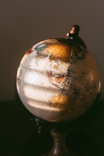 brown and white desk globe