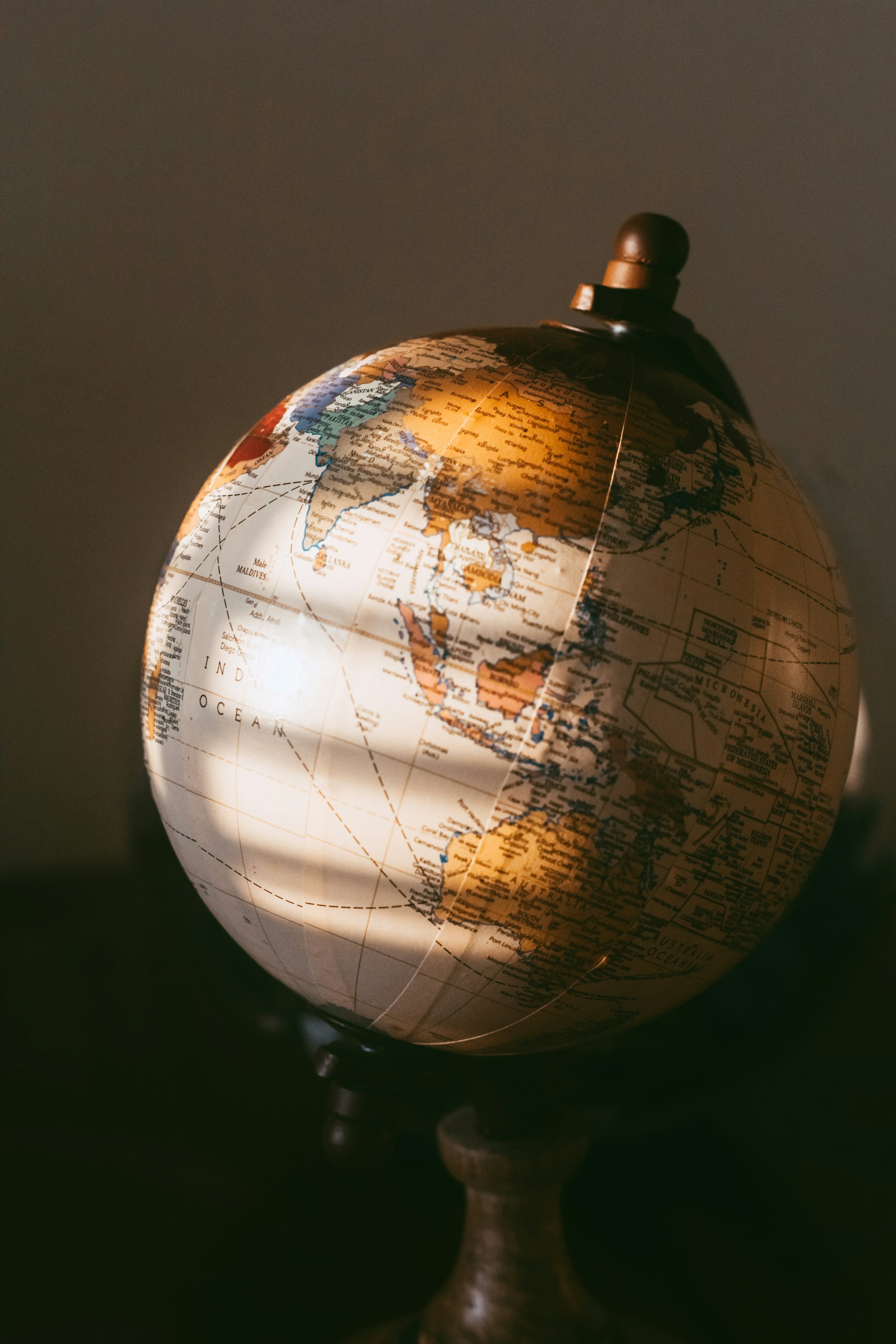 brown and white desk globe
