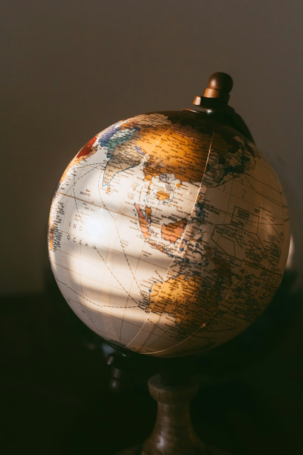 brown and white desk globe