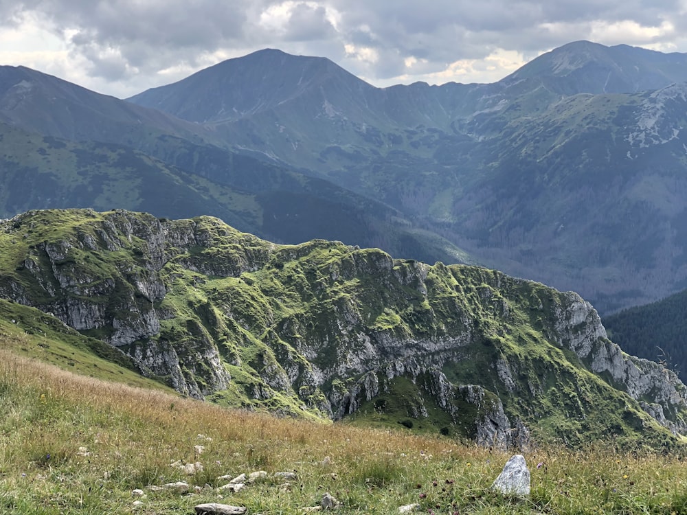 green and gray mountains under white sky during daytime