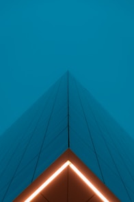 blue and orange building under blue sky