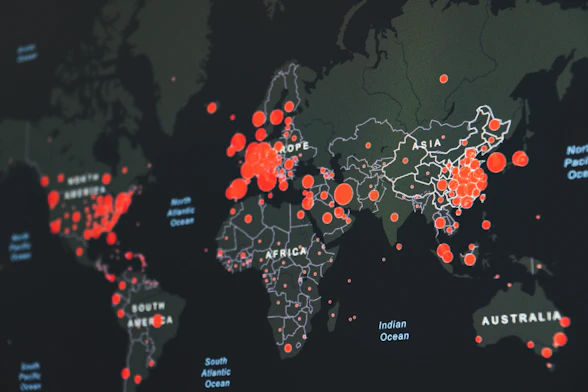 world map showing red infection clusters