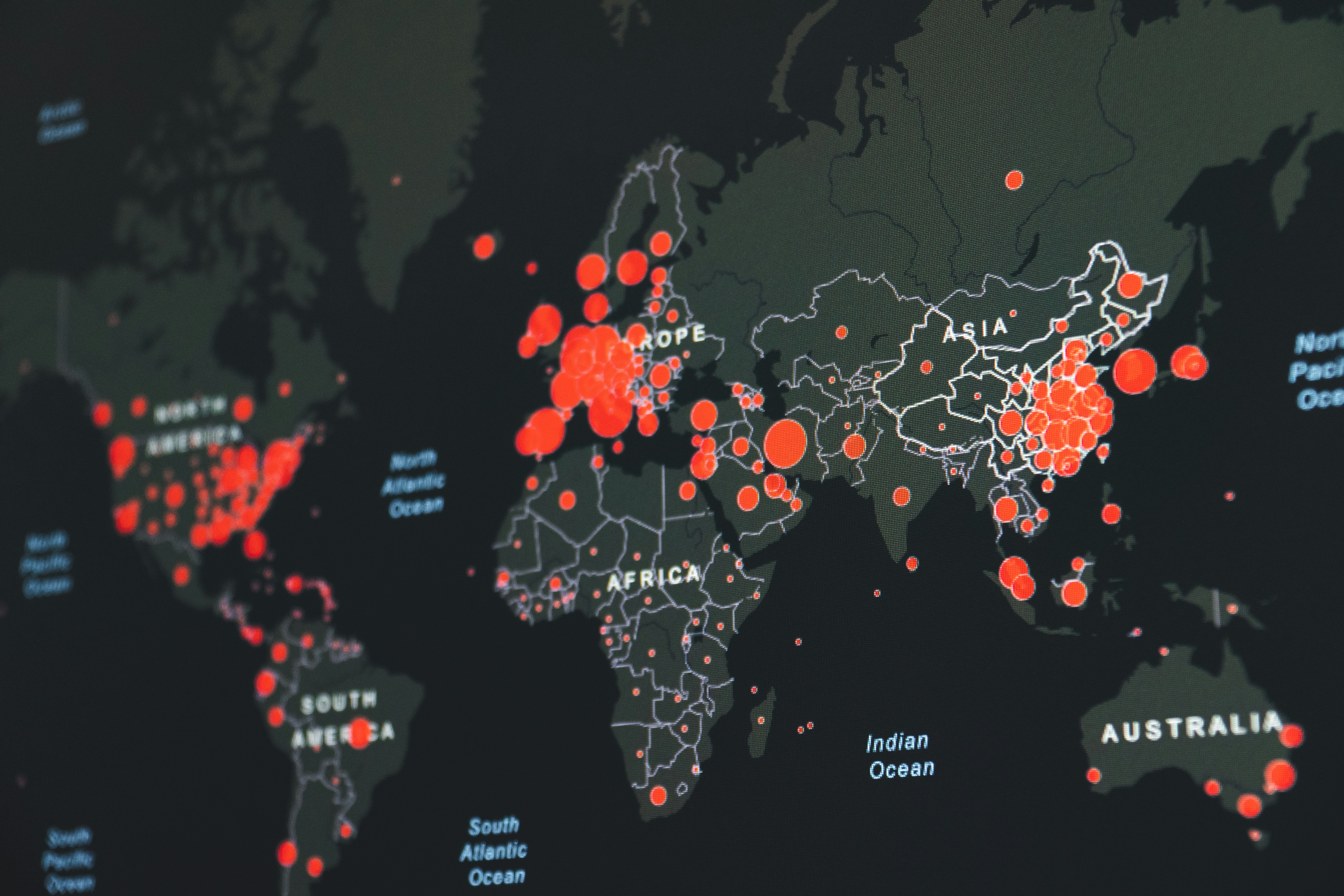 world map showing red infection clusters