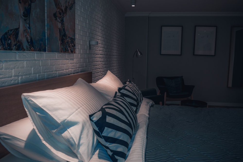 white and blue striped blanket on bed