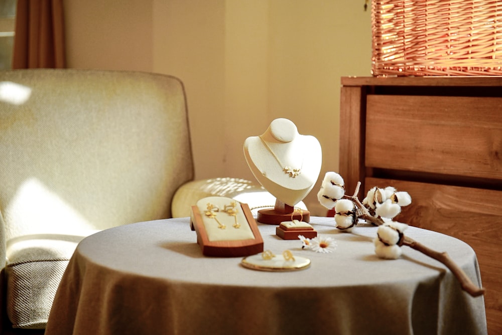 white and brown ceramic mug on brown wooden table