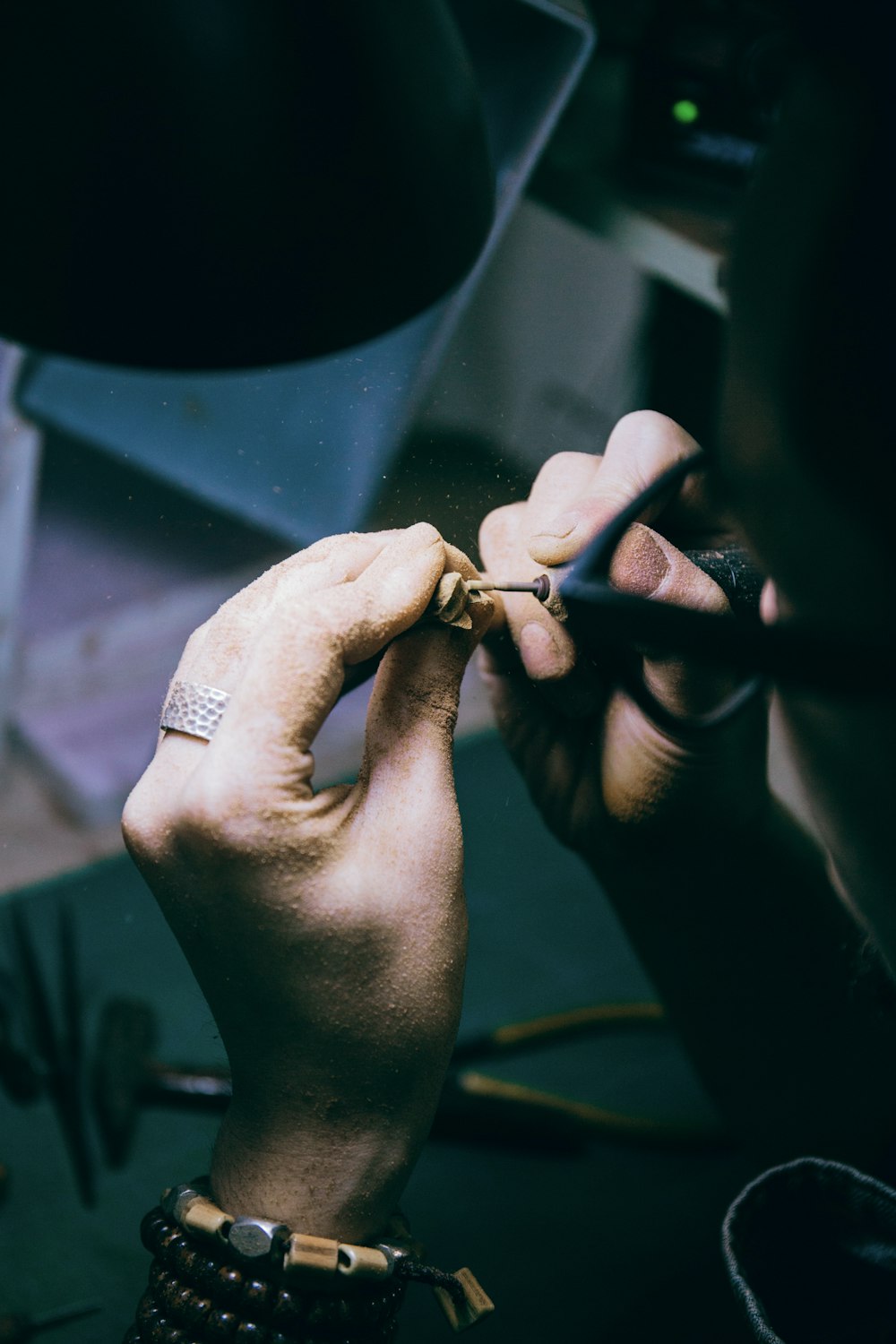 person wearing silver diamond ring