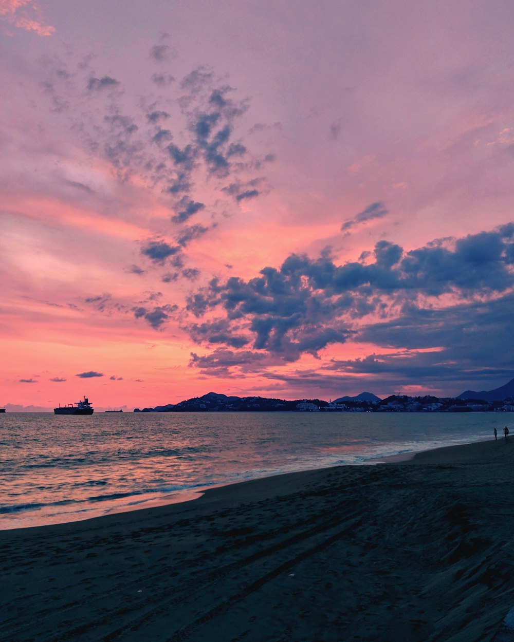 silhouette of people on beach during sunset