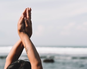 a woman with her hands up in the air