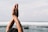 A serene image of hands clasped in prayer against a soft, blurred background.