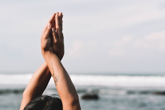 Hands in prayer pose during a calming meditation moment