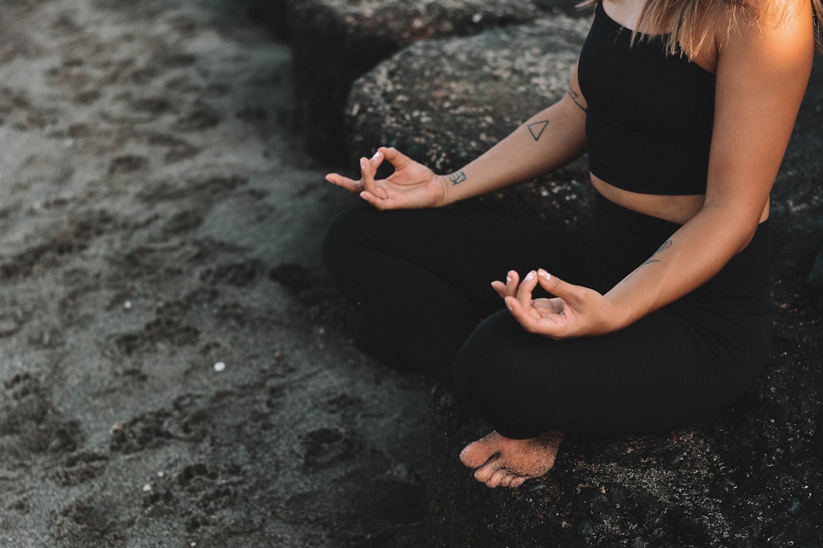 A person practicing yoga in nature