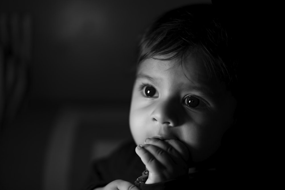 grayscale photo of childs face
