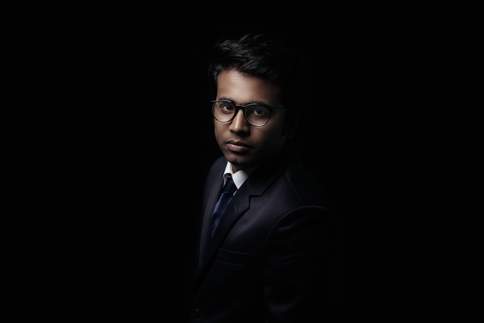 Portrait of a biology faculty member wearing glasses