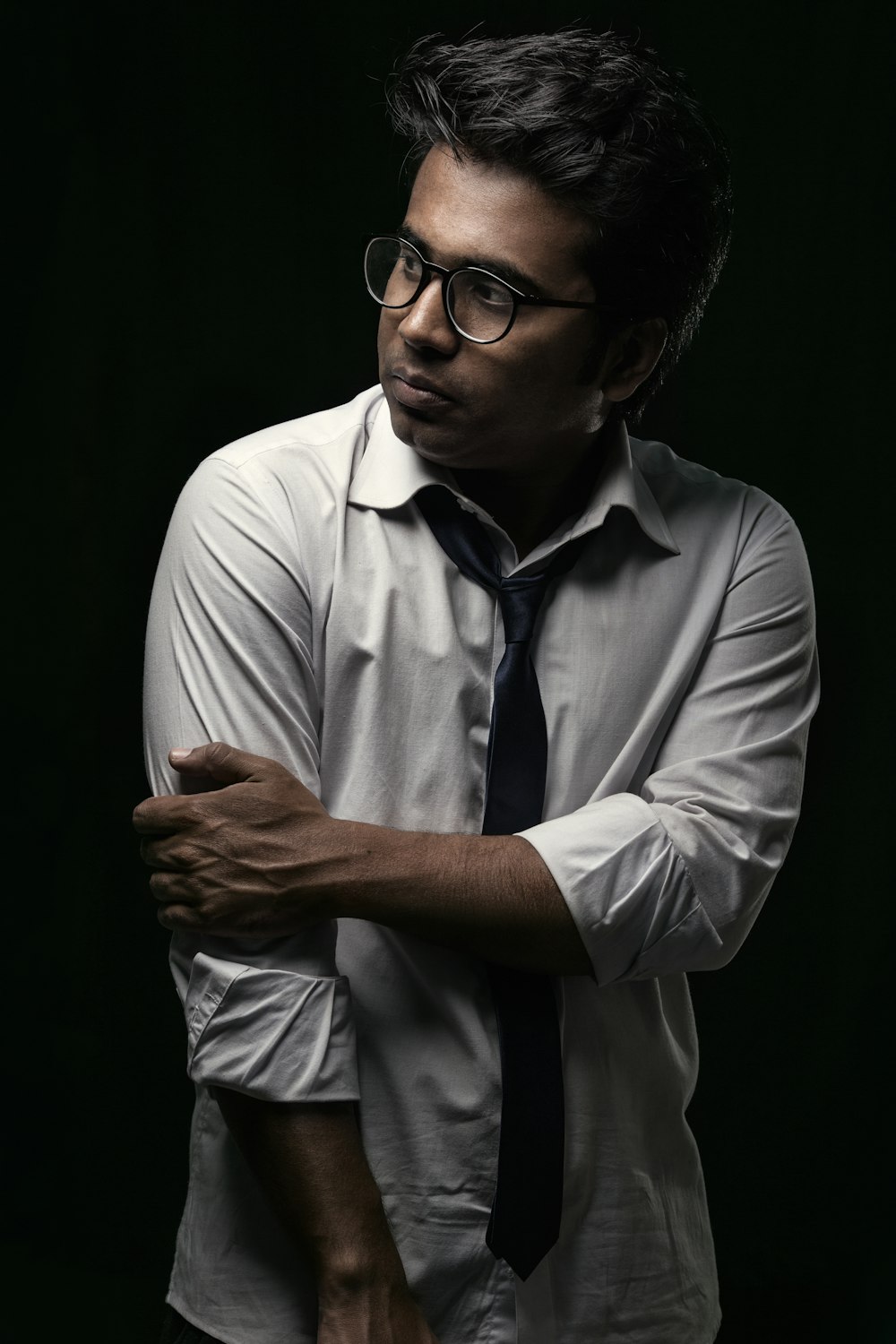 man in white dress shirt wearing black framed eyeglasses