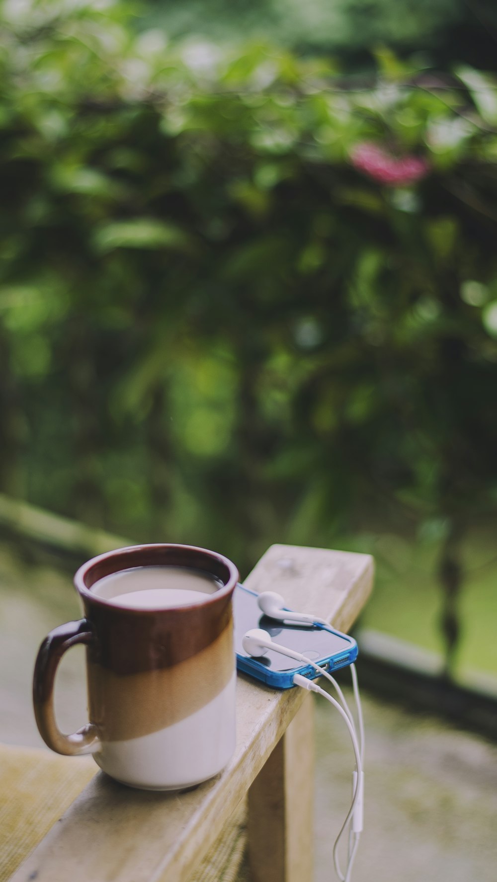 brown ceramic mug on blue book