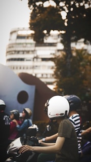 Group of riders on motu electric scooters riding confidently along a clean city street