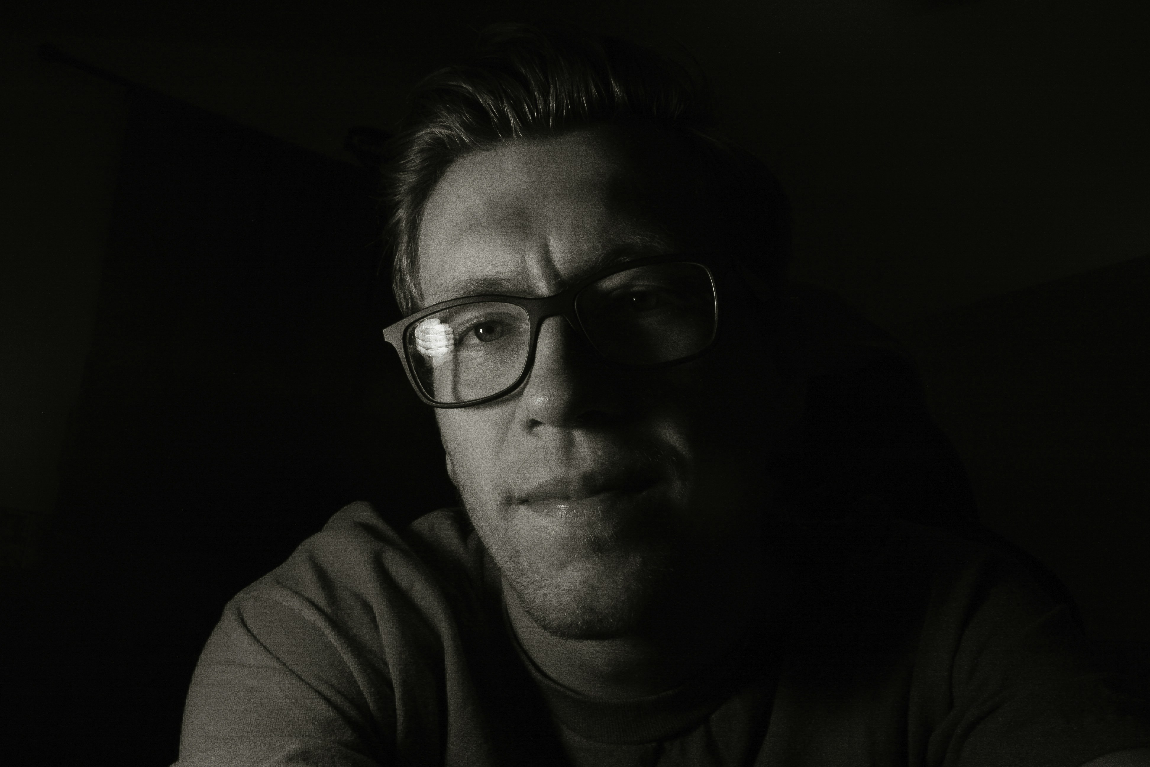 man in black framed eyeglasses