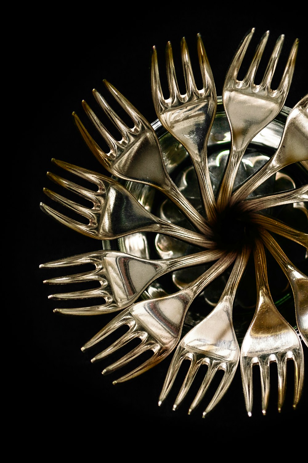 stainless steel fork lot in black background