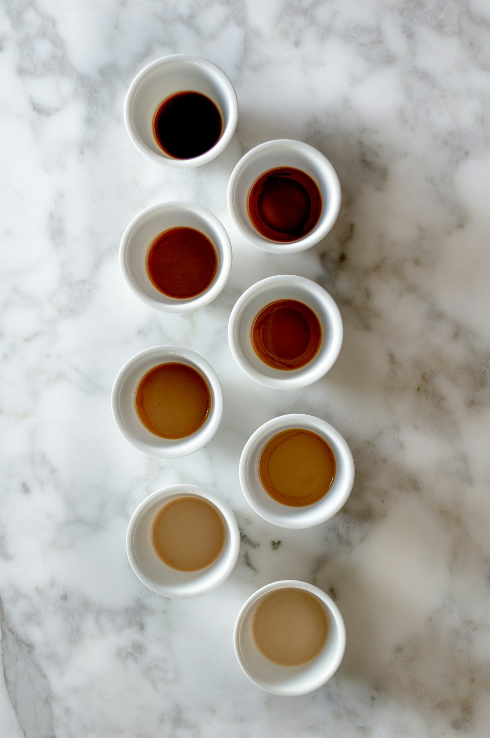 white round plastic cups on white surface