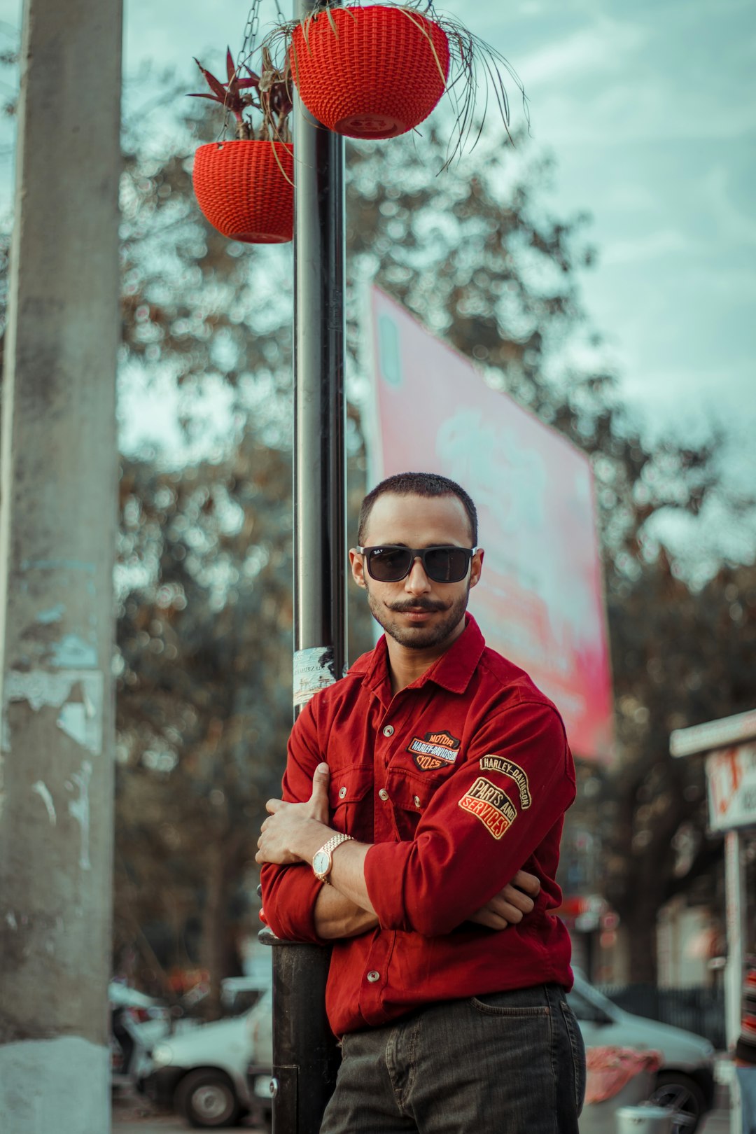 woman in red jacket wearing black sunglasses