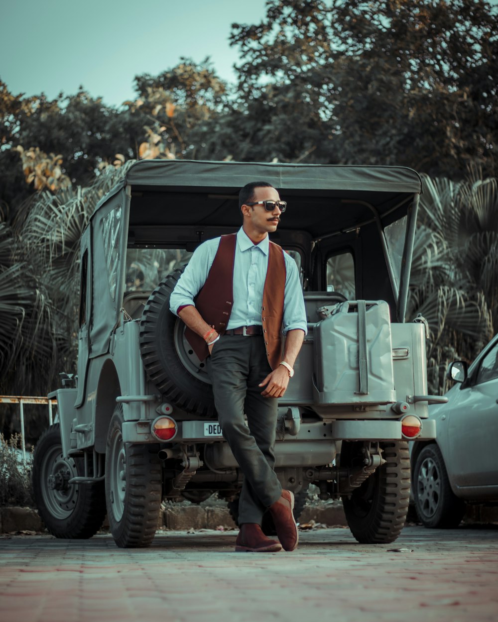 man and woman sitting on truck during daytime