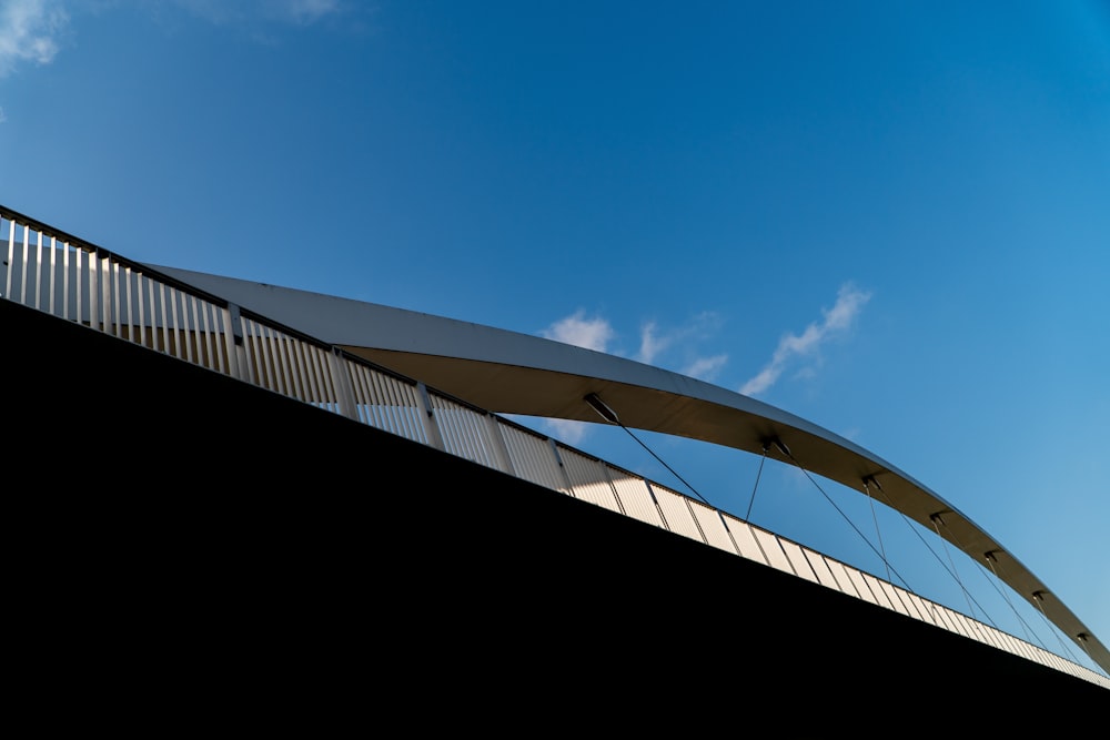 white bridge under blue sky during daytime